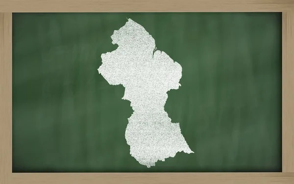 Outline map of guyana on blackboard — Stock Photo, Image