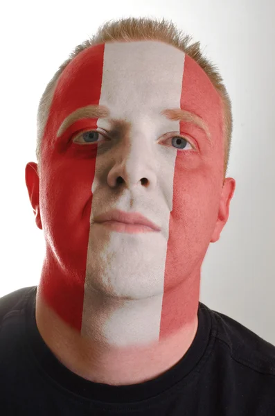 Face of serious patriot man painted in colors of peru flag — Stock Photo, Image