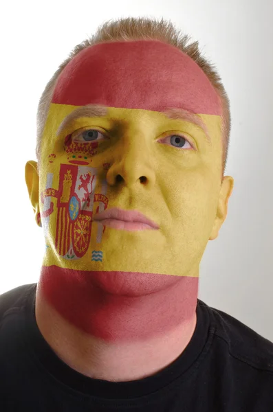 Face of serious patriot man painted in colors of spain flag — Stock Photo, Image