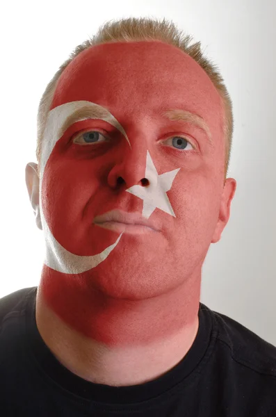 Face of serious patriot man painted in colors of turkey flag — Stock Photo, Image
