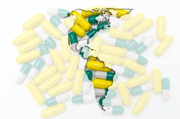 Konturkarta över Amerika med piller i bakgrunden för hälsa en — Stockfoto