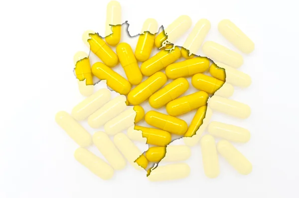 Umrisskarte von Brasilien mit Pillen im Hintergrund für Gesundheit und — Stockfoto