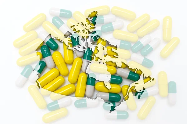 Outline map of canada with pills in the background for health an — Stock Photo, Image
