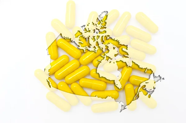 Mapa do contorno do canadá com pílulas em segundo plano para a saúde e — Fotografia de Stock
