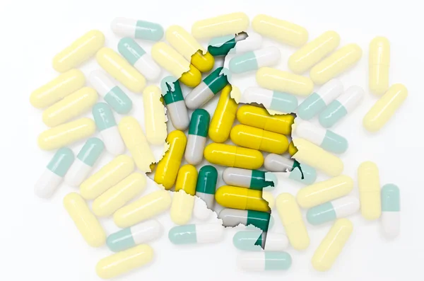 Konturkarta över colombia med piller i bakgrunden för hälsa — Stockfoto