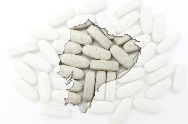 Outline map of ecuador with pills in the background for health a — Stock Photo, Image