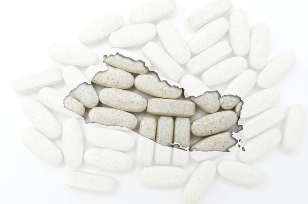 A tabletták, a háttérben a heal szerkezeti salvador Térkép — Stock Fotó