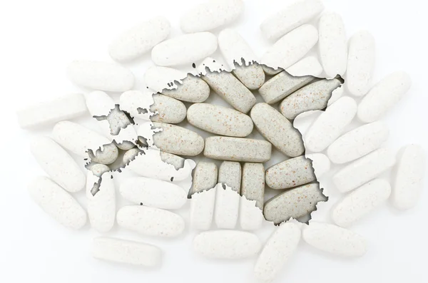 Outline map of estonia with pills in the background for health a — Stock Photo, Image