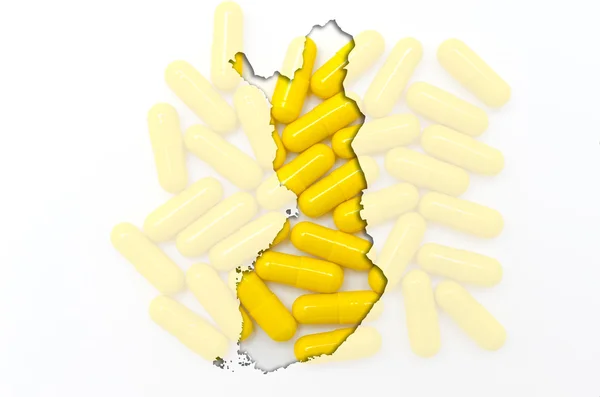 Mapa do contorno da Finlândia com pílulas em segundo plano para a saúde a — Fotografia de Stock