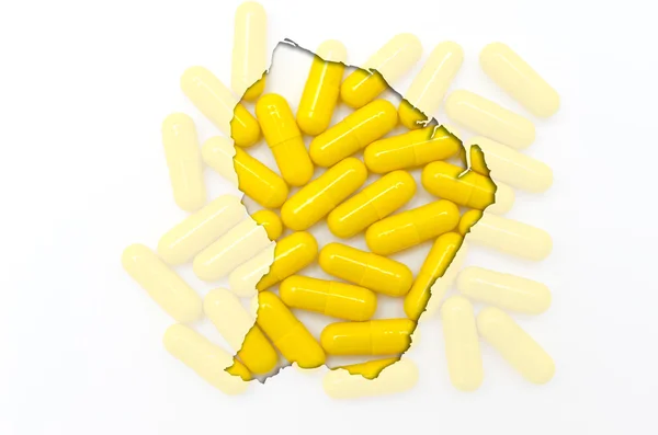 Mapa do esboço de guiana francesa com pílulas em segundo plano para ele — Fotografia de Stock
