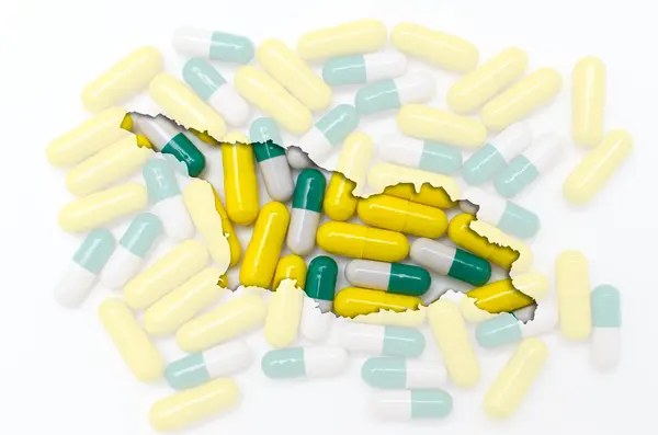 Konturkarta över Georgien med piller i bakgrunden för hälsa en — Stockfoto