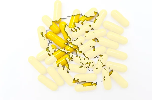 Mapa do contorno da grécia com pílulas em segundo plano para a saúde e — Fotografia de Stock