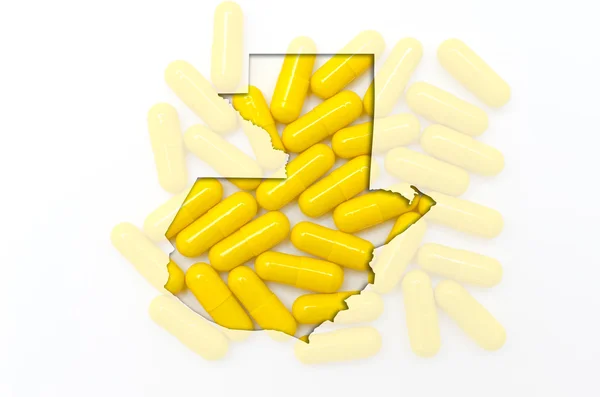 Mapa do contorno de guatemala com pílulas em segundo plano para a saúde — Fotografia de Stock