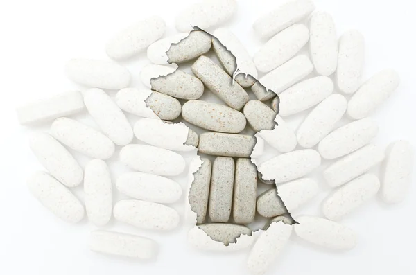 Outline map of guyana with pills in the background for health an — Stock Photo, Image