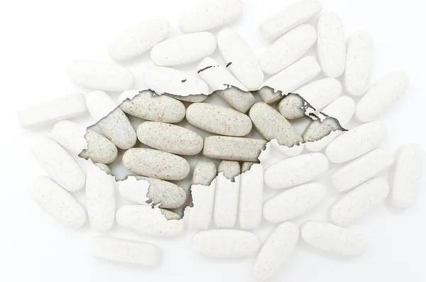 Outline map of honduras with pills in the background for health — Stock Photo, Image