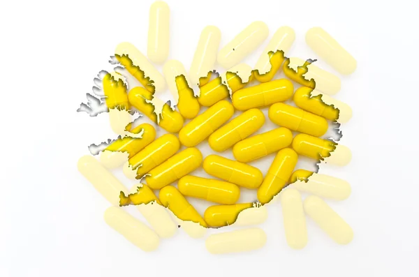 Mapa do contorno da Islândia com pílulas em segundo plano para a saúde a — Fotografia de Stock