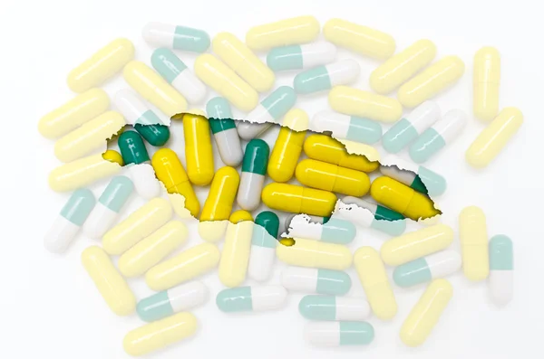 Outline map of jamaica with pills in the background for health a — Stock Photo, Image