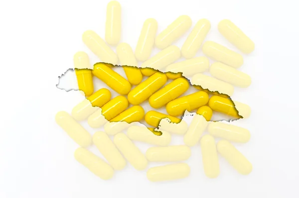 Umrisskarte von Jamaica mit Pillen im Hintergrund für Gesundheit a — Stockfoto