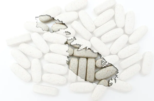 Outline map of malta with pills in the background for health an — Stock Photo, Image