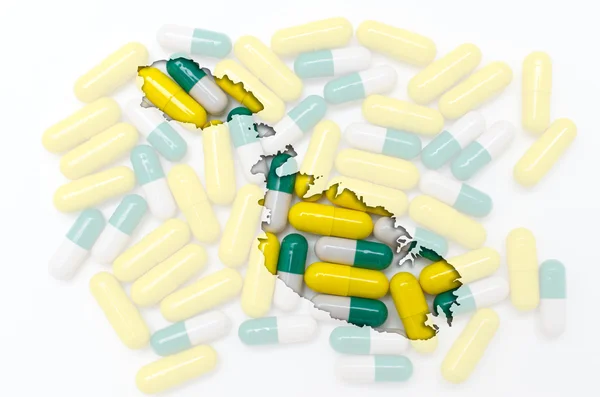 Konturkarta över malta med piller i bakgrunden för hälsa en — Stockfoto