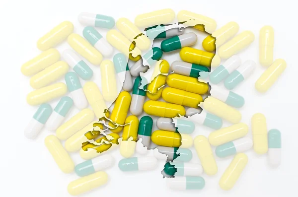 Περίγραμμα της Ολλανδίας με διαφανή χάπια σε το backgro — Φωτογραφία Αρχείου