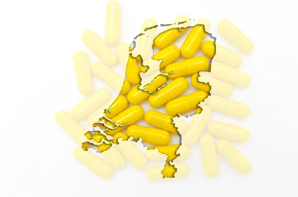 Mapa de los Países Bajos con píldoras transparentes en el backgro — Foto de Stock