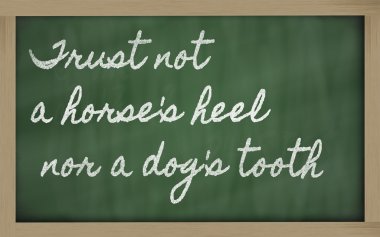 Expression - Trust not a horse's heel nor a dog's tooth - writt clipart