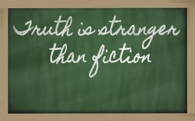 Expression - Truth is stranger than fiction - written on a scho clipart