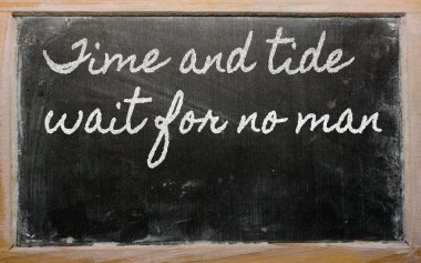 Expression - Time and tide wait for no man - written on a schoo clipart