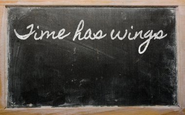 Expression - Time has wings - written on a school blackboard wi clipart