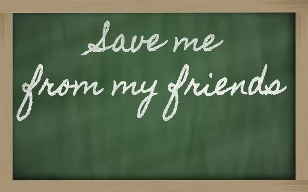 Expression - Save me from my friends - written on a school black — стоковое фото