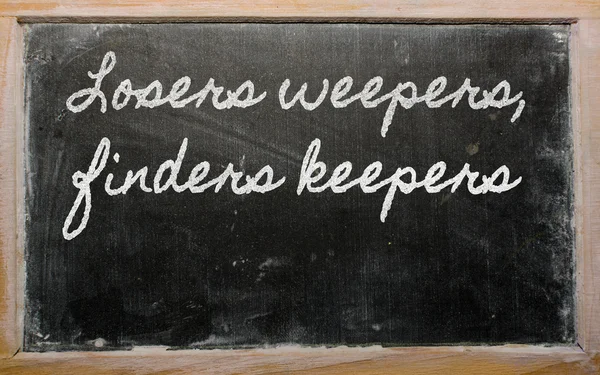 Uttryck - förlorare weepers, finders keepers - skrivit på en sch — Stockfoto