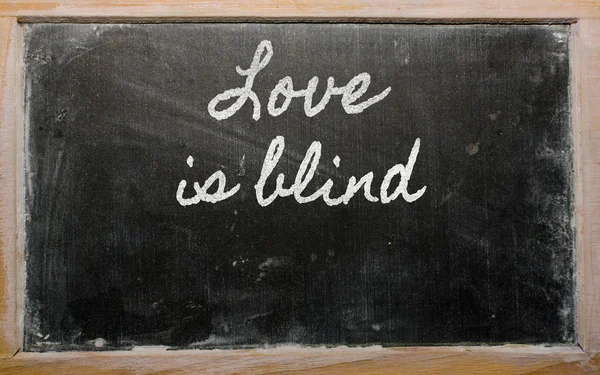 Expression - Love is blind - written on a school blackboard wit — Stock Photo, Image