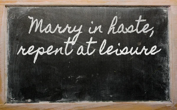 stock image Expression - Marry in haste, repent at leisure - written on a s