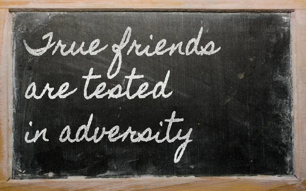 Expression - True friends are tested in adversity - written on — Stock Photo, Image