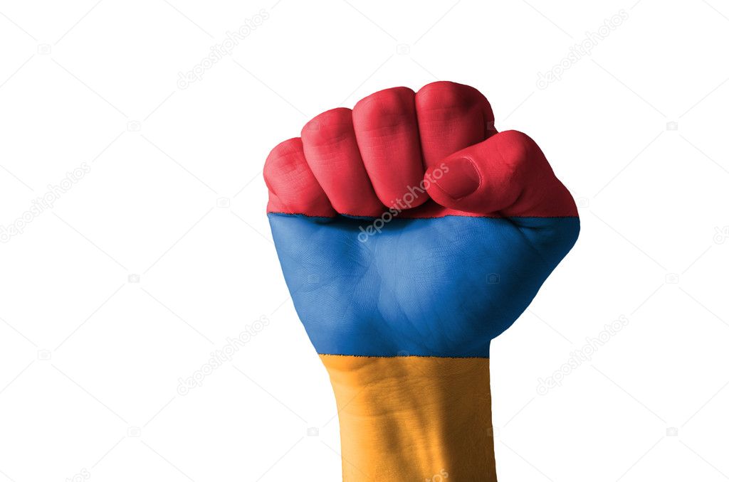 Fist painted in colors of armenia flag