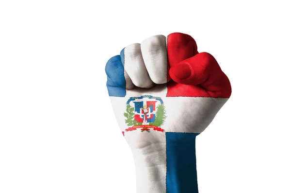 Vuist geschilderd in kleuren van de vlag van dominica — Stockfoto