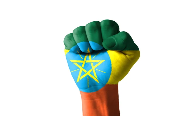 Vuist geschilderd in kleuren van de vlag van Ethiopië — Stockfoto