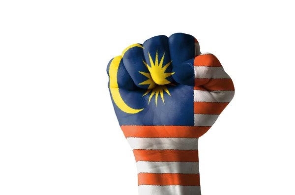 Vuist geschilderd in kleuren van de vlag van Maleisië — Stockfoto