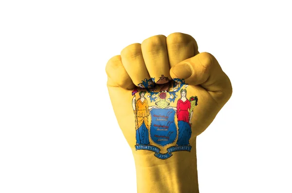 Кулак раскрашен в цвета нашего штата Нью-Джерси флаг — стоковое фото