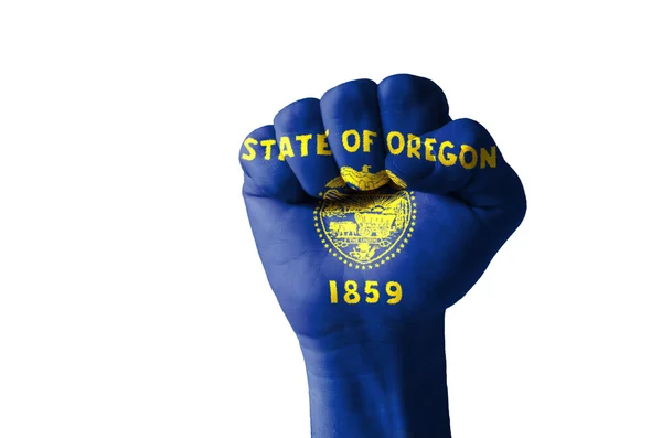 Fist painted in colors of us state of oregon flag — Stock Photo, Image