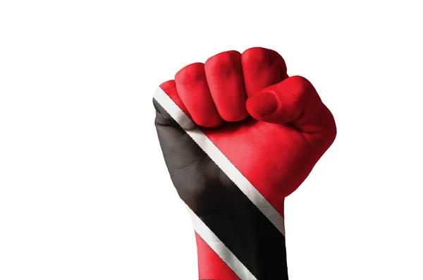 Näve målad i färger av trinidad tobago flagga — Stockfoto