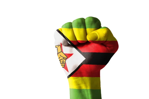 Pugno dipinto con colori di bandiera zimbabwe — Foto Stock