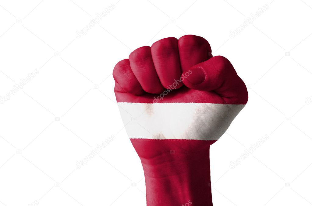 Fist painted in colors of latvia flag