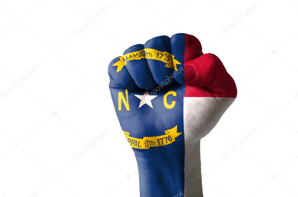 Fist painted in colors of us state of north carolina flag