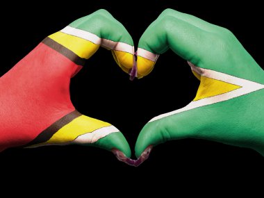 Heart and love gesture by hands colored in guyana flag for touri clipart