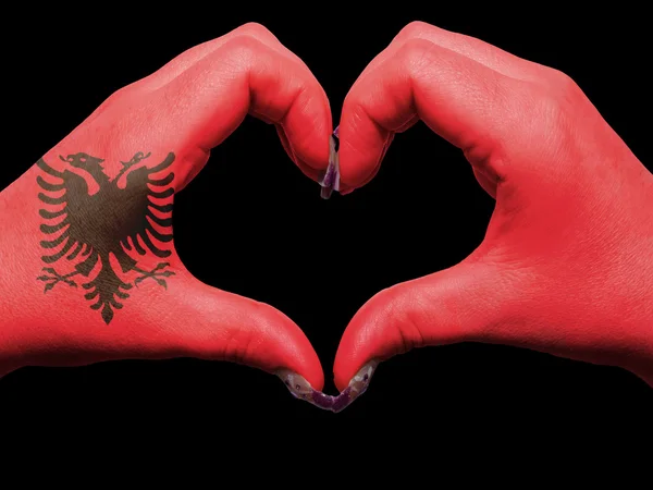 Heart and love gesture by hands colored in albania flag for tour — Stock Photo, Image