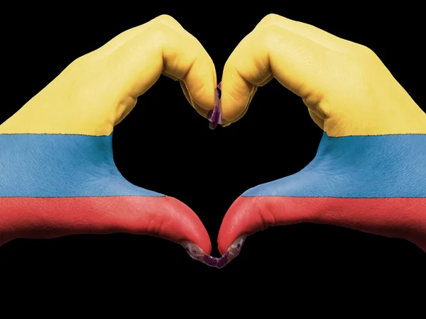 Heart and love gesture by hands colored in colombia flag for tou — Stock Photo, Image