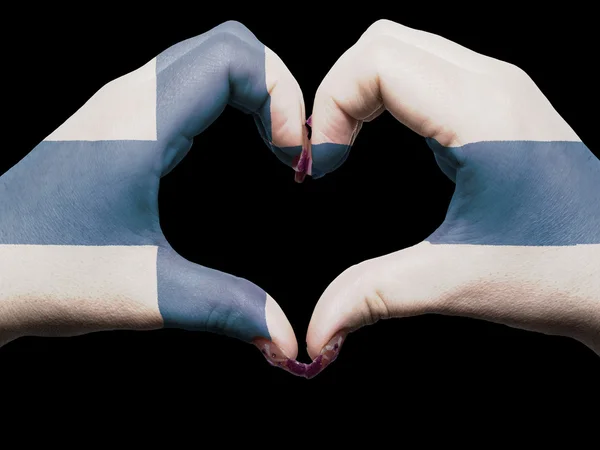 Szív és a szeretet gesztusa, kezében színes finn zászló túra — Stock Fotó