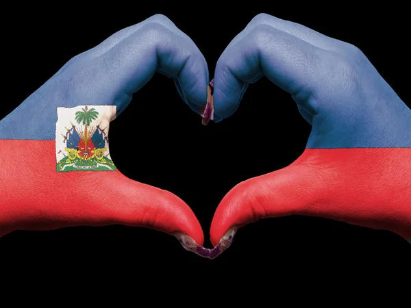 Heart and love gesture by hands colored in haiti flag for touris — Stock Photo, Image